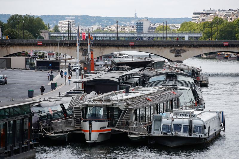 River cruise ships are seen parked on the Seine river