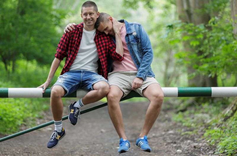Gay married couple Dawid Mycek and Jakub Kwiecinski pose for