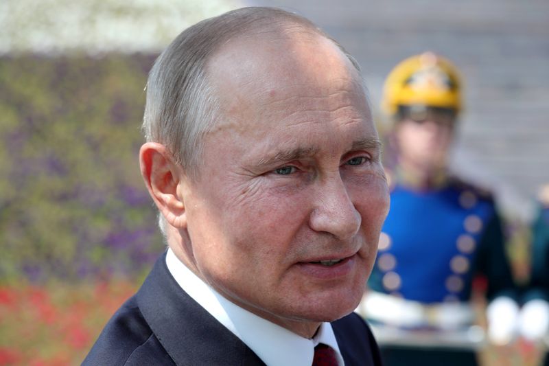 Russian President Vladimir Putin attends an awards ceremony marking Russia