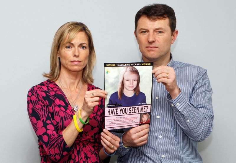 FILE PHOTO: Kate and Gerry McCann pose with a computer