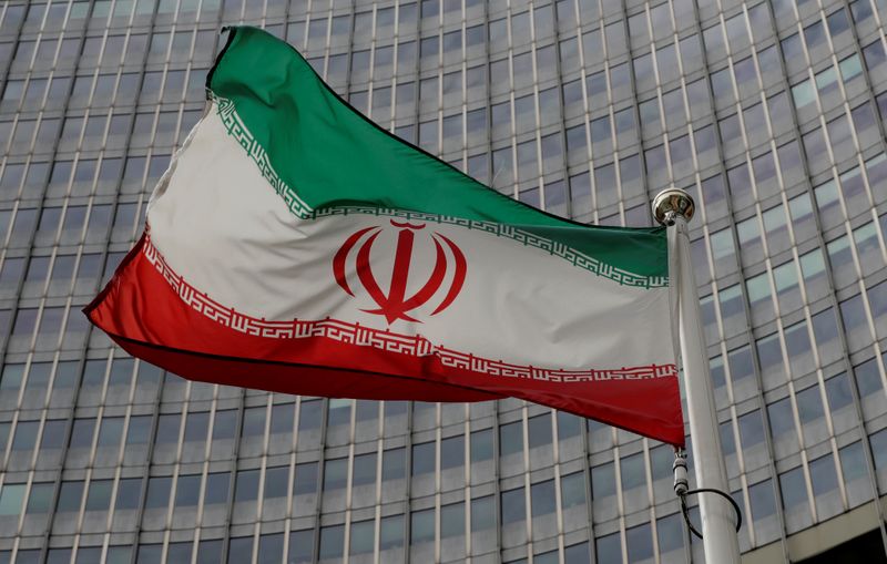 An Iranian flag flutters in front of the IAEA headquarters
