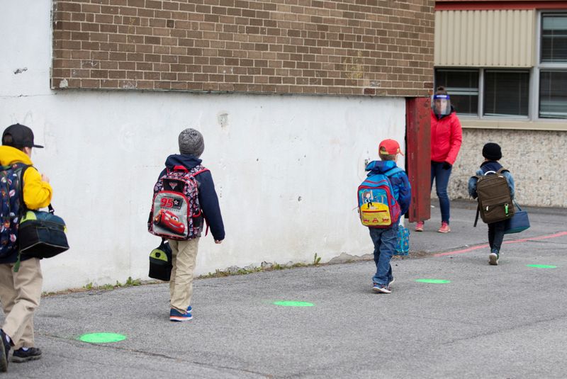 FILE PHOTO: Green dots are placed in a schoolyard as