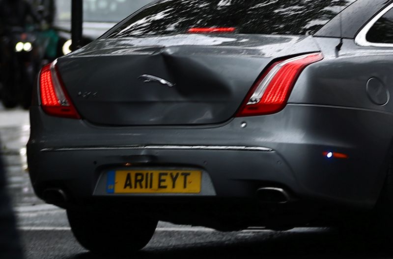 The dented car carrying Britain’s Prime Minister Boris Johnson leaves