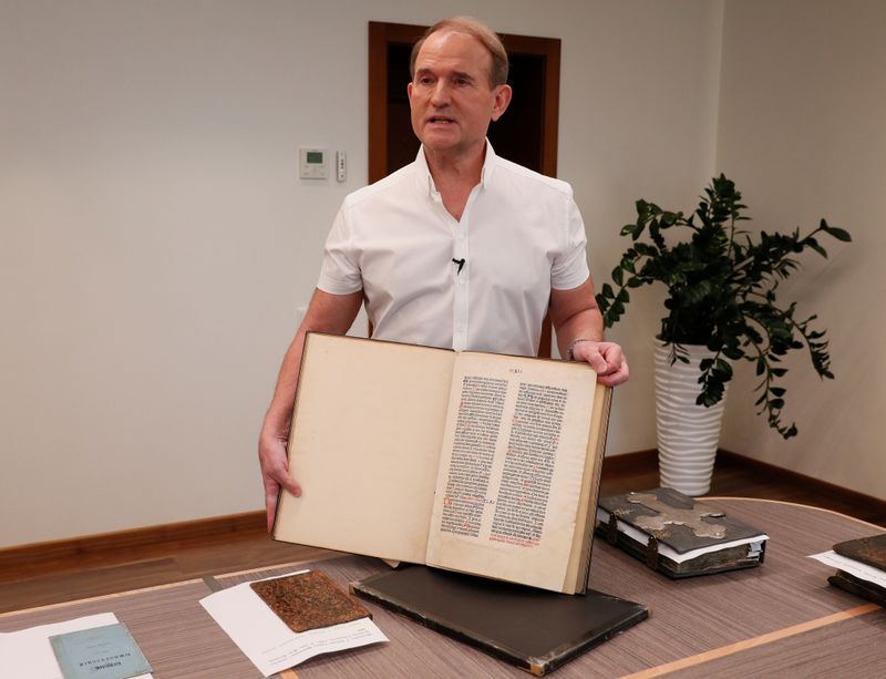Ukrainian opposition politician Medvedchuk shows a fragment of the Gutenberg