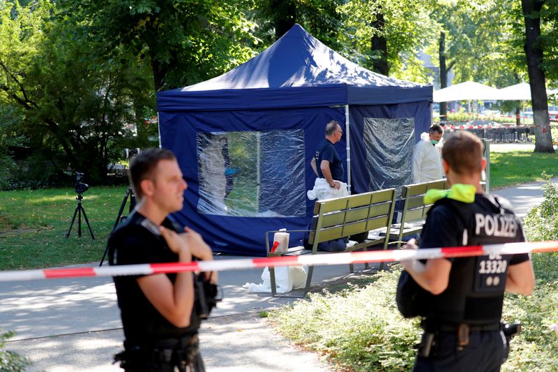 FILE PHOTO: Police officers investigate a crime scene in Berlin
