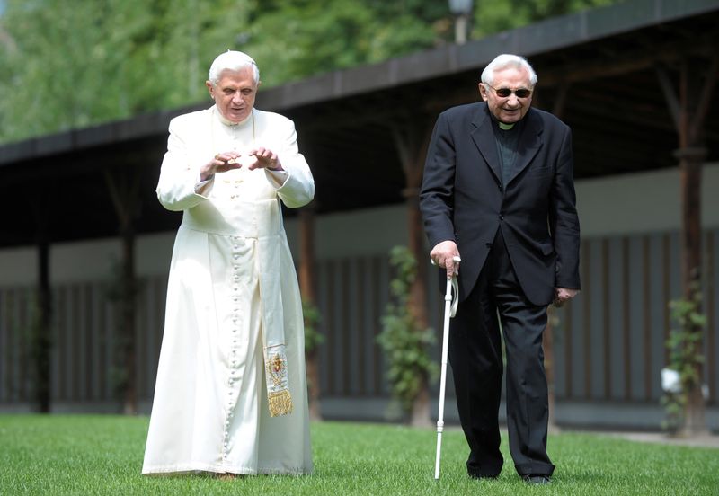 FILE PHOTO: Pope Benedict XVI strolls in a garden with