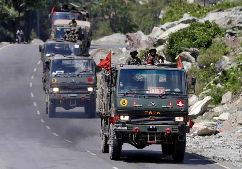 Indian Army convoy moves along a highway leading to Ladakh,