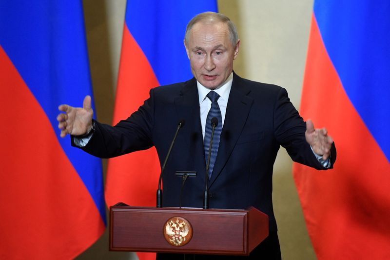 FILE PHOTO: Russian President Vladimir Putin delivers a speech in