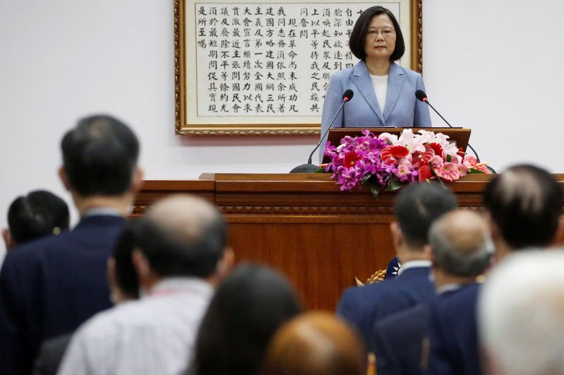 Taiwan President Tsai Ing-wen talks to police officers at the