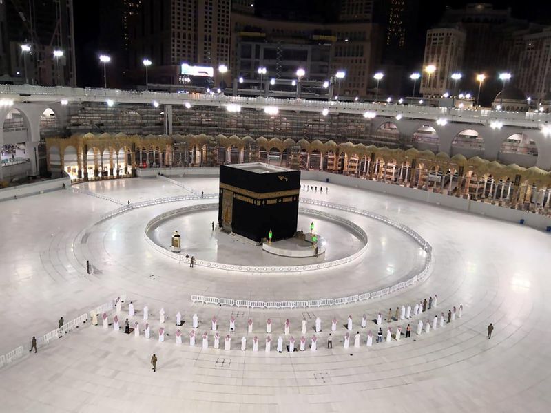 A small group of worshippers pray at Kaaba in the