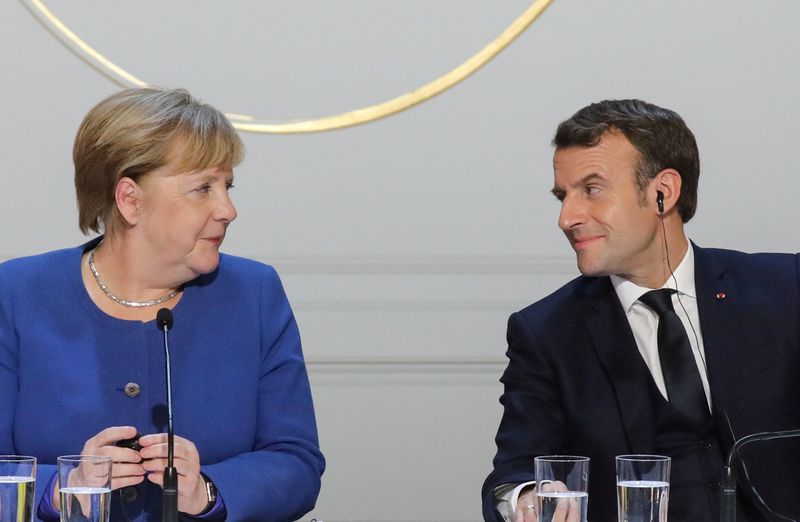 FILE PHOTO: German Chancellor Angela Merkel and French President Emmanuel
