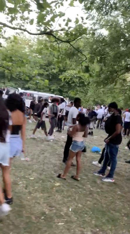 Peple gather at an illegal rave in Streatham, London