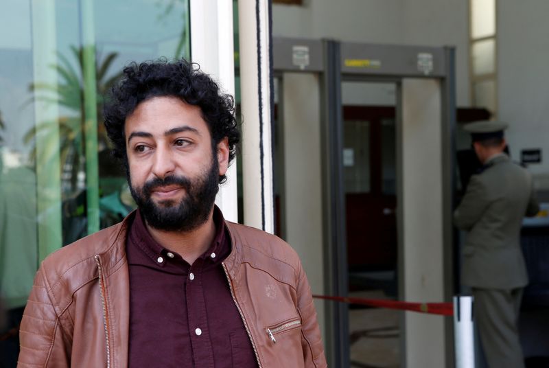 FILE PHOTO: Journalist and activist Omar Radi waits outside court