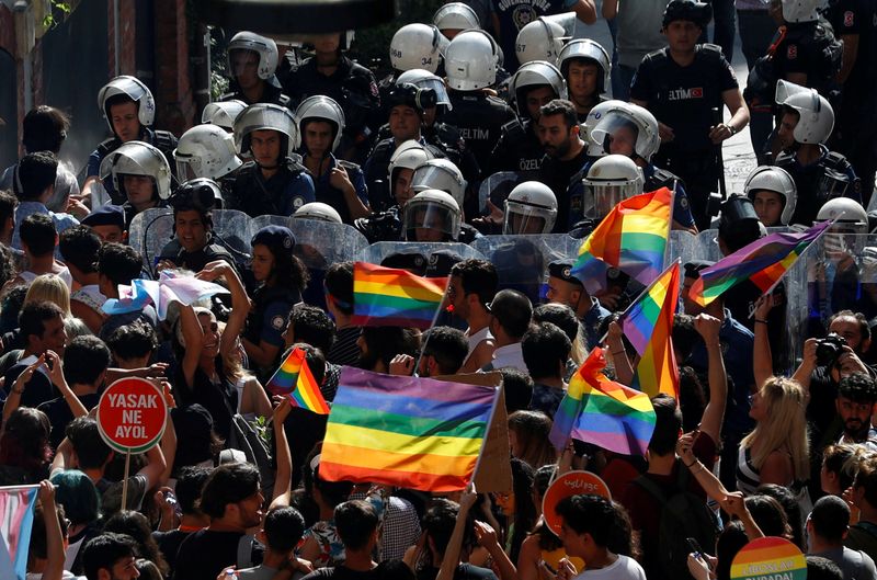FILE PHOTO: Riot police prevent LGBT rights activists from marching