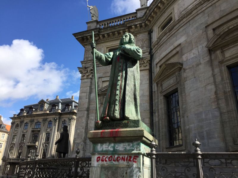 The statue of Hans Egede is seen after being vandalized