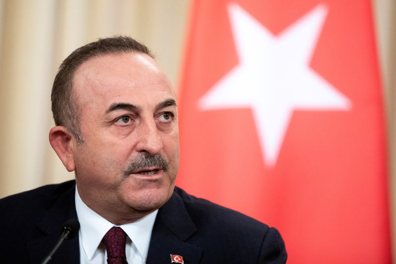 Turkish Foreign Minister Mevlut Cavusoglu speaks during a joint news