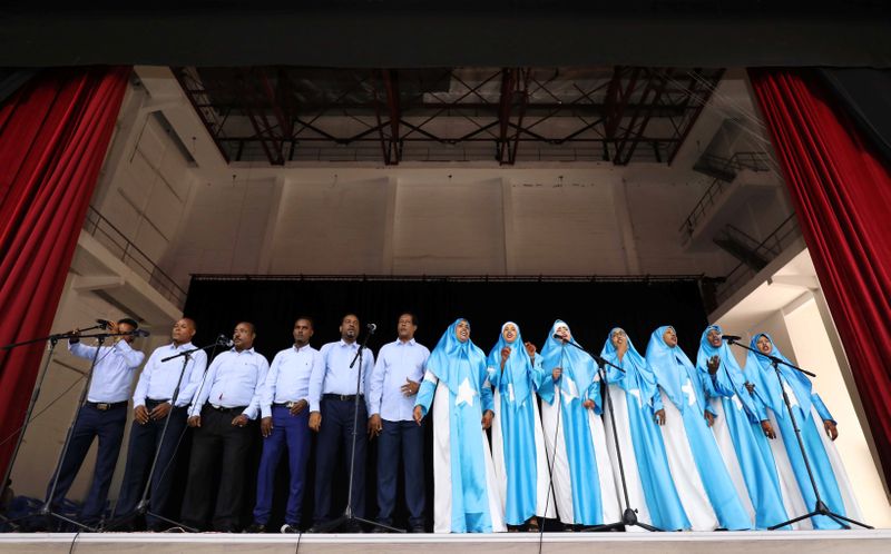A choir sings inside a renovated Somalia’s National Theatre in