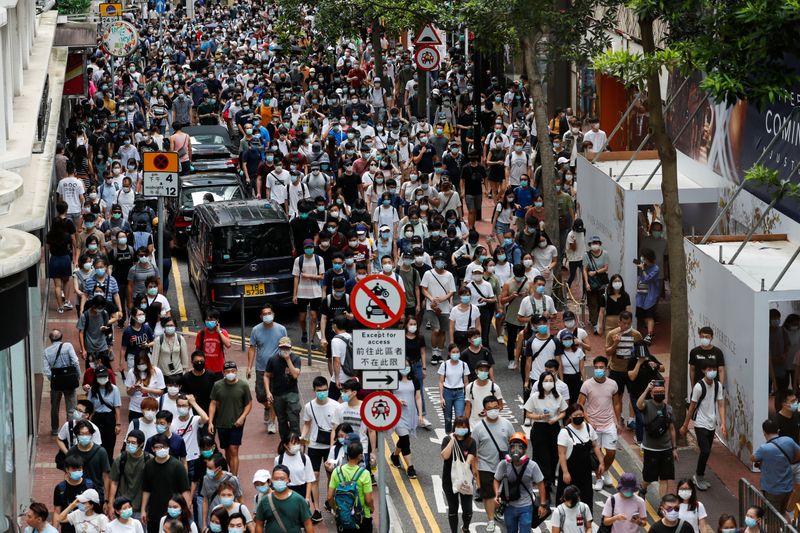 Anti-national security law protesters march at the anniversary of Hong