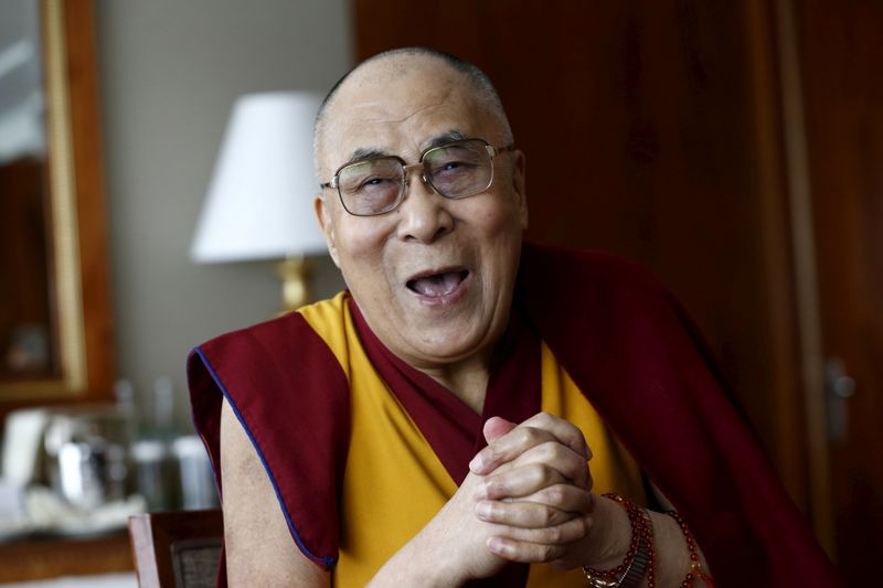 FILE PHOTO: Tibetan spiritual leader the Dalai Lama talks with
