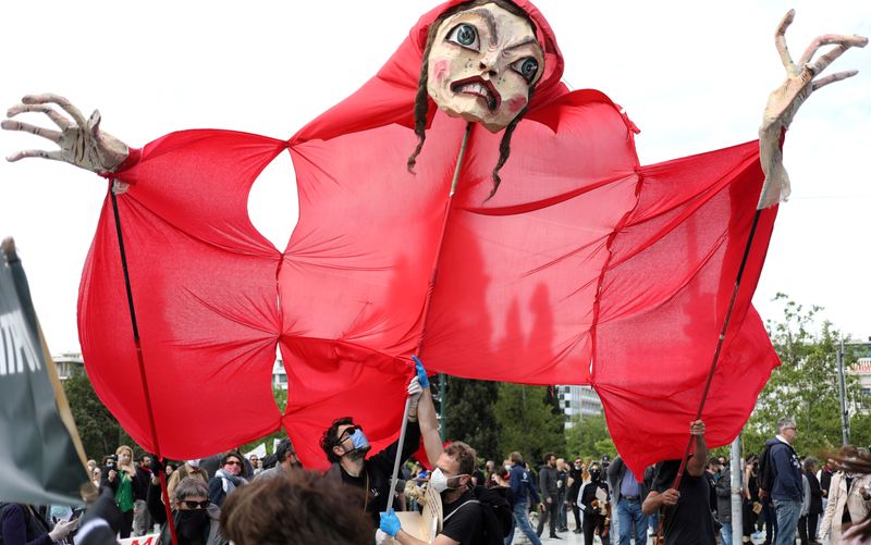 FILE PHOTO: Demonstrators carry an effigy during a protest outside