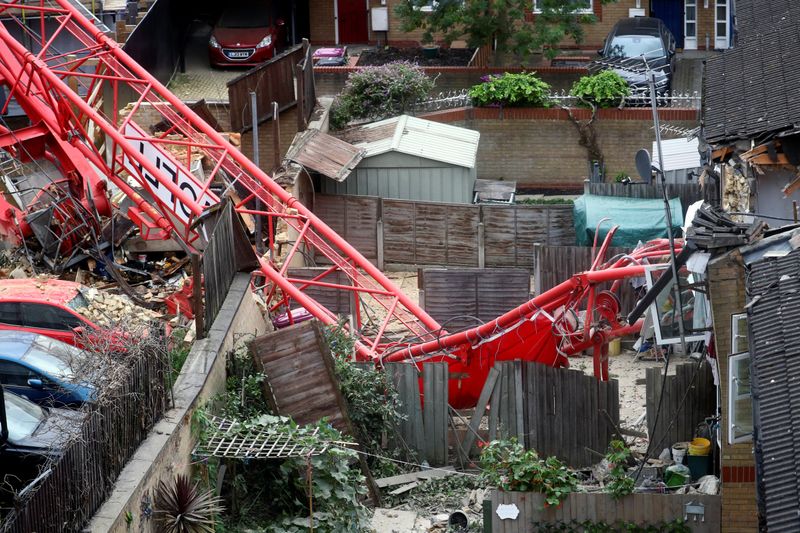 A collapsed crane is seen near a construction site in