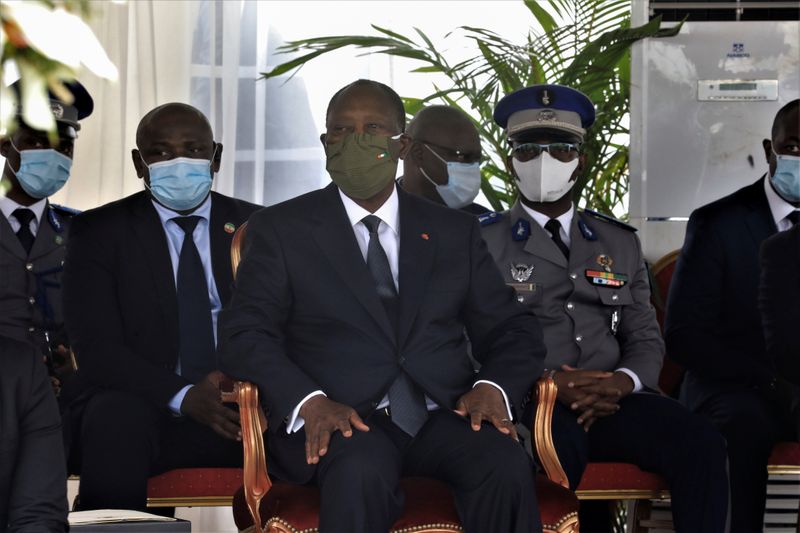 Ivory Coast President Alassane Ouattara attends a national tribute ceremony