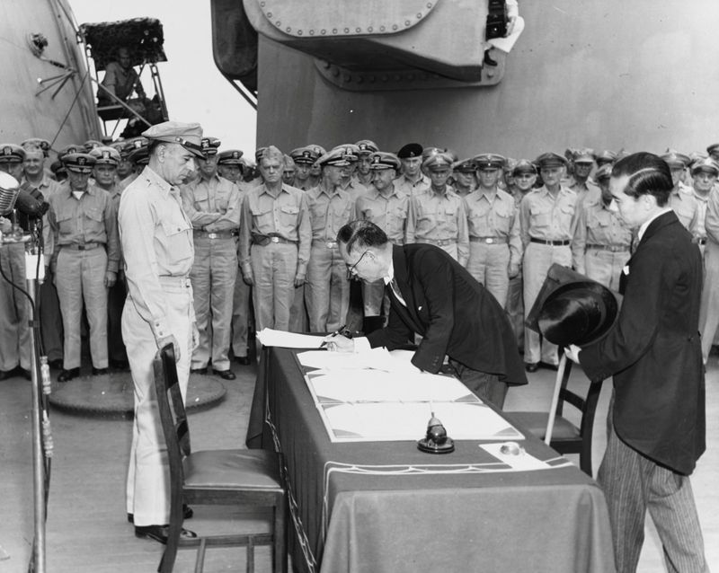 FILE PHOTO: Japan’s Foreign Minister Mamoru Shigemitsu signs the Instrument