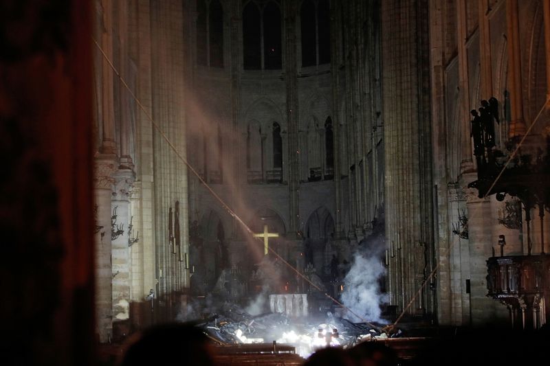 FILE PHOTO: Smoke rises around the altar in front of
