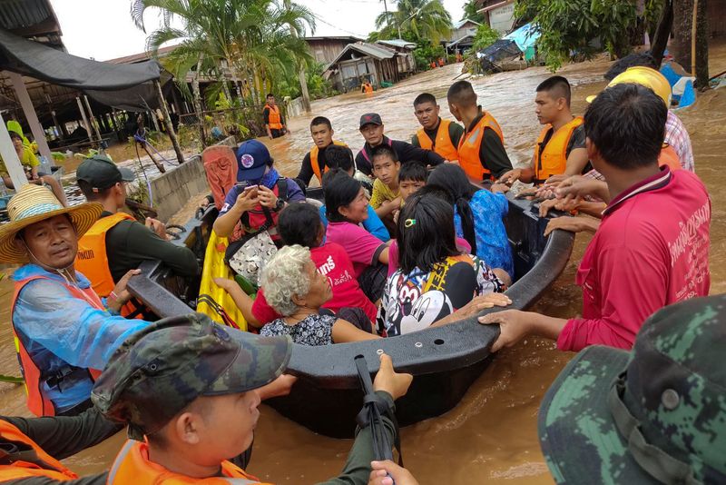 Soldiers evacuate villagers affected by heavy rain at Muang district