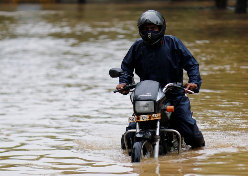 A man got stuck on his bike in a flooded
