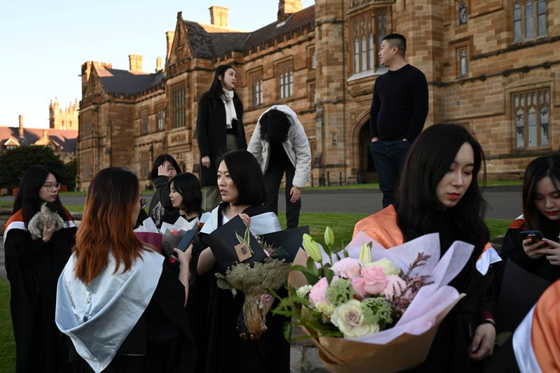 The Wider Image: Chinese students in Australia head home as