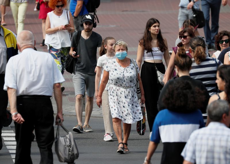 Pedestrians cross a street in central Kyiv