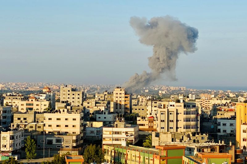 Smoke rises following an Israeli air strike in Gaza Strip