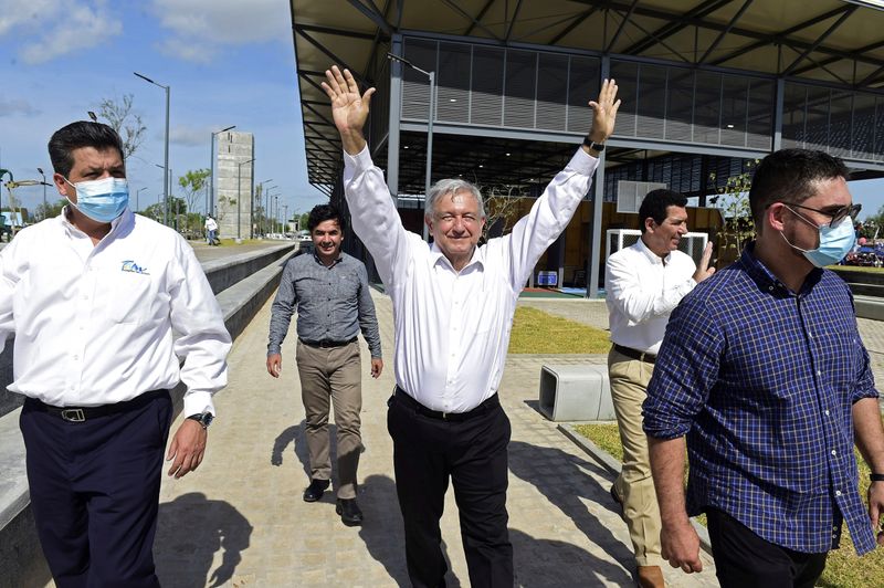 Mexico’s President Andres Manuel Lopez Obrador gestures while arriving to