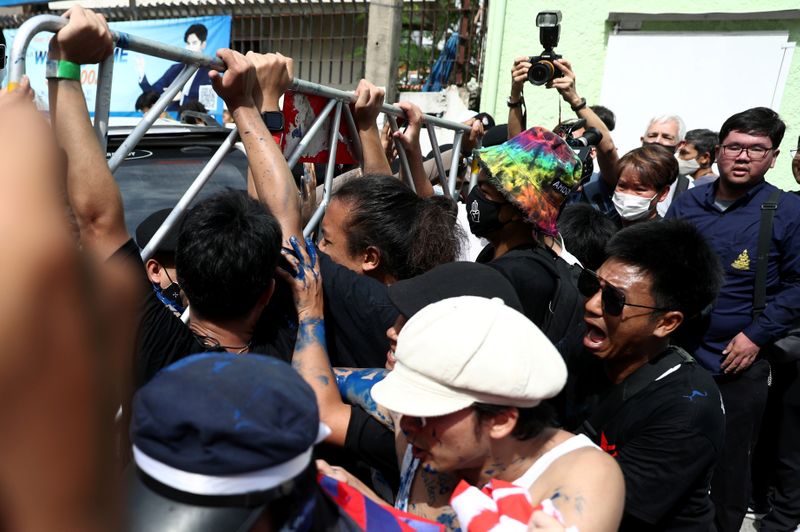 Pro-democracy protesters confront police officers in Bangkok