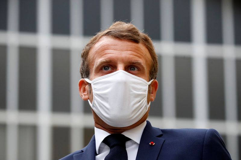 French President Emmanuel Macron visits a site of pharmaceutical group