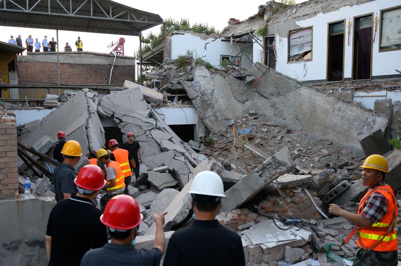 Rescue workers are seen at the site where a restaurant