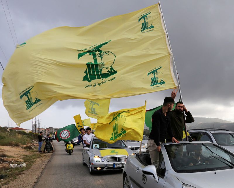 FILE PHOTO: A supporter of Lebanon’s Hezbollah gestures as he