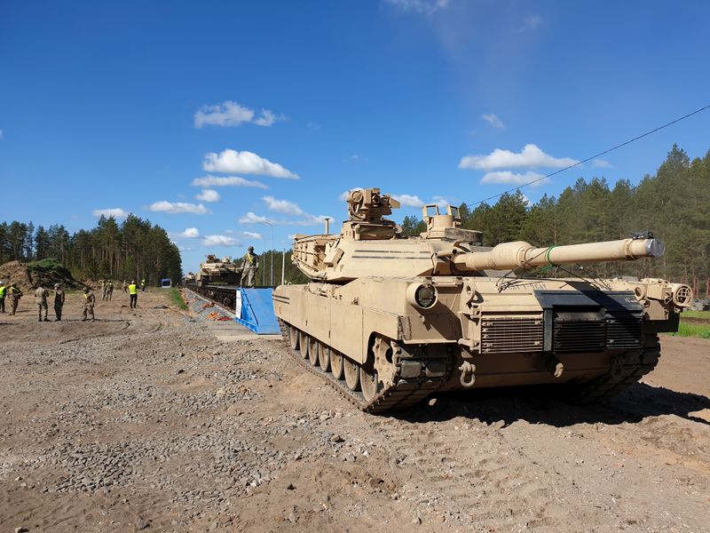 U.S. Abrams tanks are loaded on rail in Pabrade training