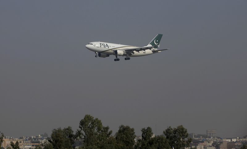 FILE PHOTO: A Pakistan International Airlines (PIA) passenger plane arrives