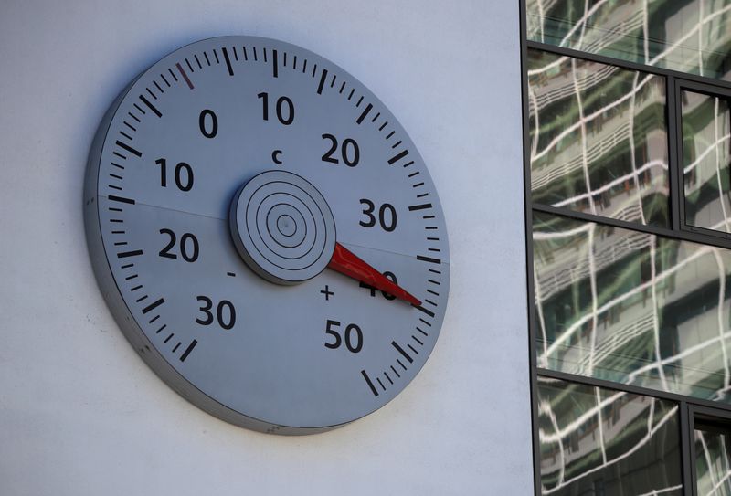 FILE PHOTO: A thermometer mounted on a wall of the