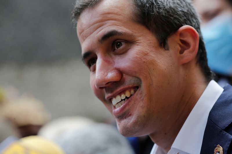 Venezuelan opposition leader Juan Guaido takes part in a news