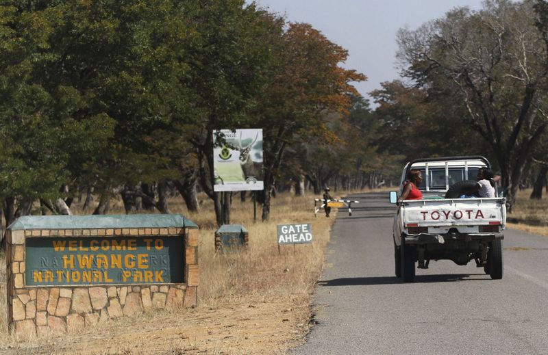 FILE PHOTO:  A vehicle carries visitors arriving at Zimbabwe’s
