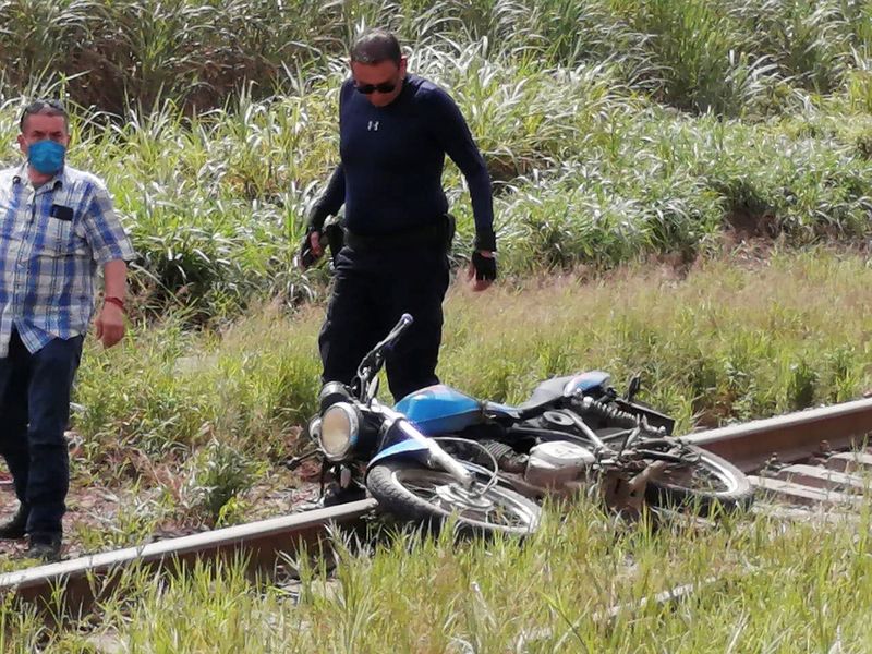 A motorcycle is seen at the site where the body