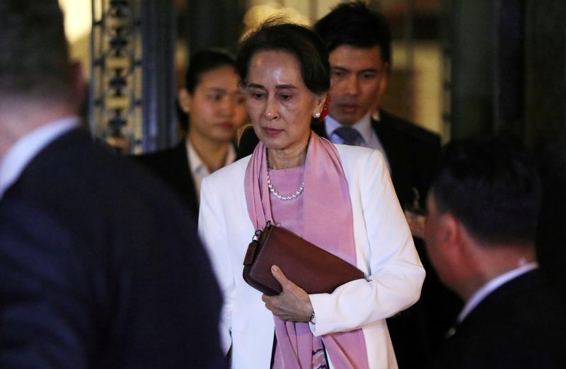 FILE PHOTO: Myanmar’s leader Aung San Suu Kyi leaves the