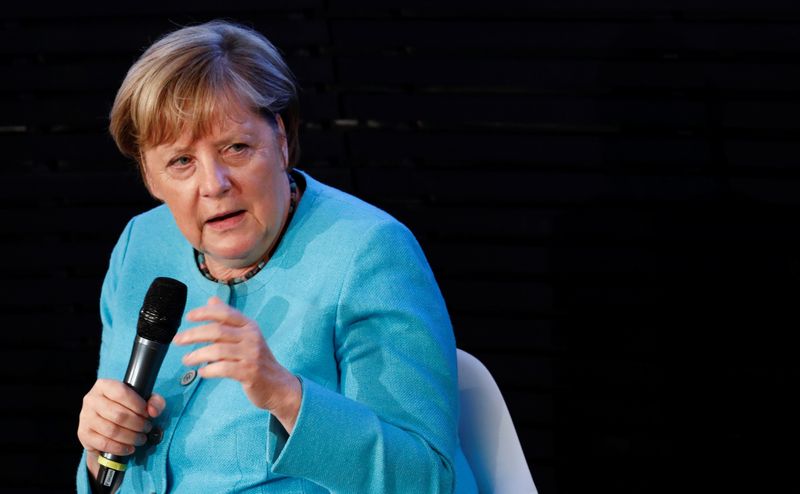 German Chancellor Angela Merkel and former EU Council President Donald