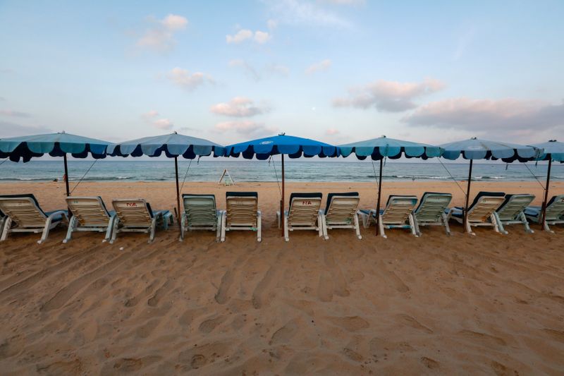 FILE PHOTO: Empty chairs are seen on a beach which