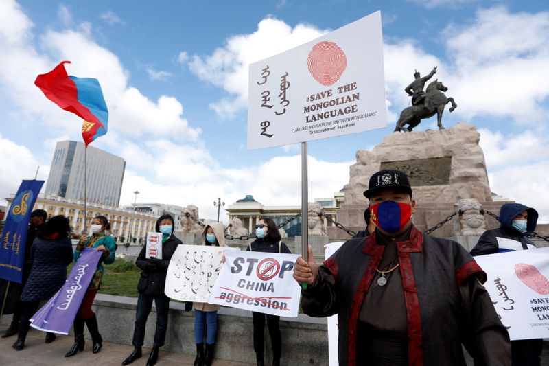 Demonstrators protesting against China’s changes to school curriculums that remove