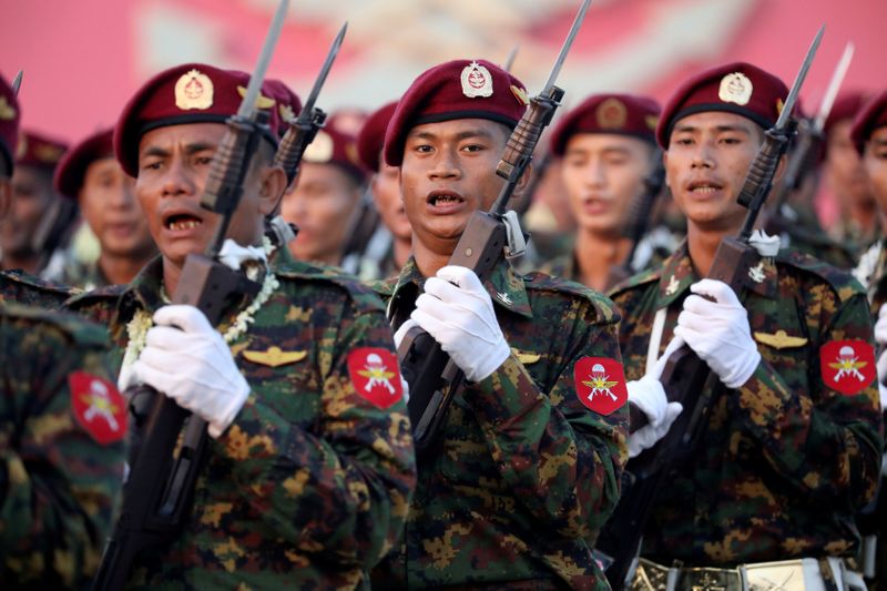 FILE PHOTO: Soldiers take part in a military parade to