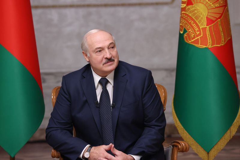 Belarusian President Alexander Lukashenko attends an interview with journalists of